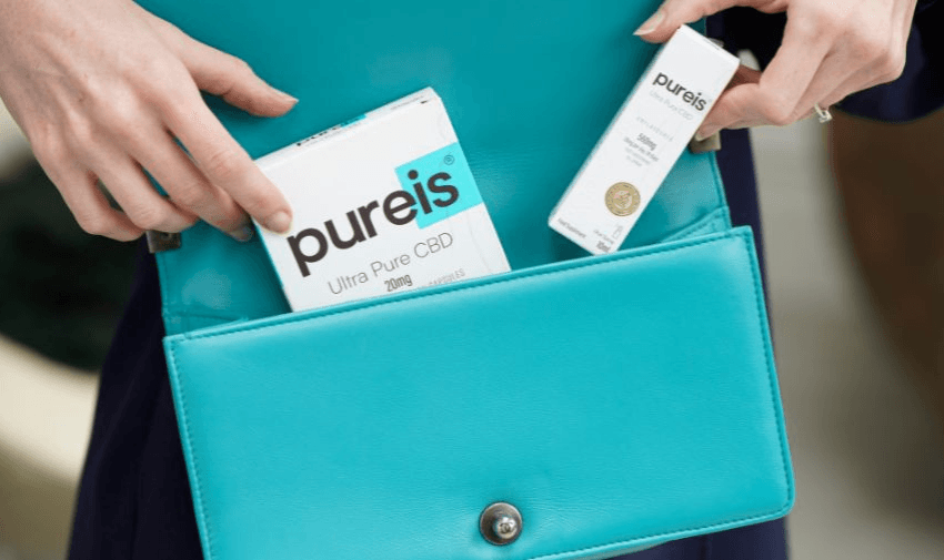 Hands holding Pureis CBD products in purse, Purpl discounts for disabilities and long term health conditions, shopping discounts for disabled people.