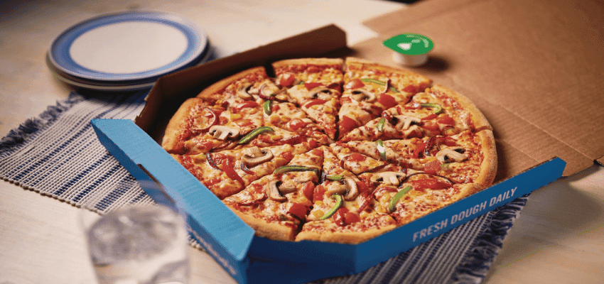 Open Domino’s pizza box on table, Purpl discounts for disabilities and long term health conditions, mobility discounts and offers.