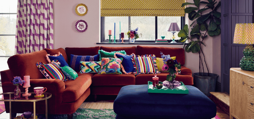 Colourful living room with velvet sofa, Dunelm Purpl discounts for disabilities and long term health conditions, shopping discounts for disabled people.