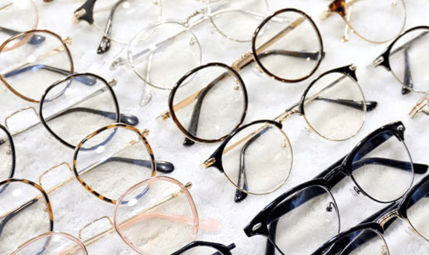 Assorted eyeglass frames laid out, Glasses Direct Purpl discounts for disabilities and long term health conditions, shopping discounts for disabled people.