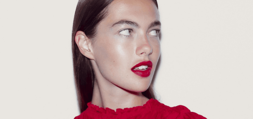 Woman in red lipstick looking sideways, Cult Beauty Purpl discounts for disabilities and long term health conditions, shopping discounts for disabled people.