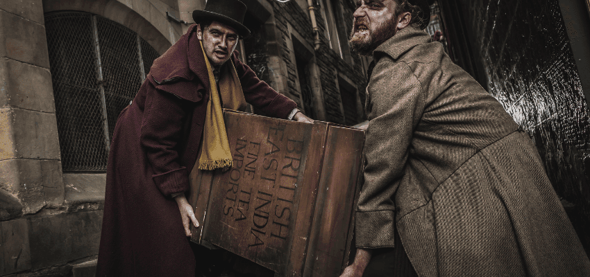 Scary actors dressed as zombies reaching towards the camera at The Edinburgh Dungeon attraction, UK disability discount deals.