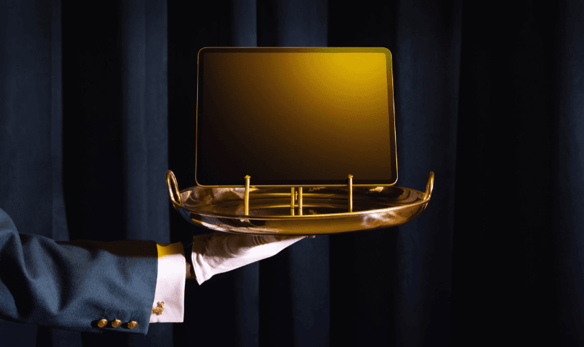 Waiter holding gold tray with screen, Back Market Purpl discounts for disabilities and long term health conditions, mobility discounts and offers.
