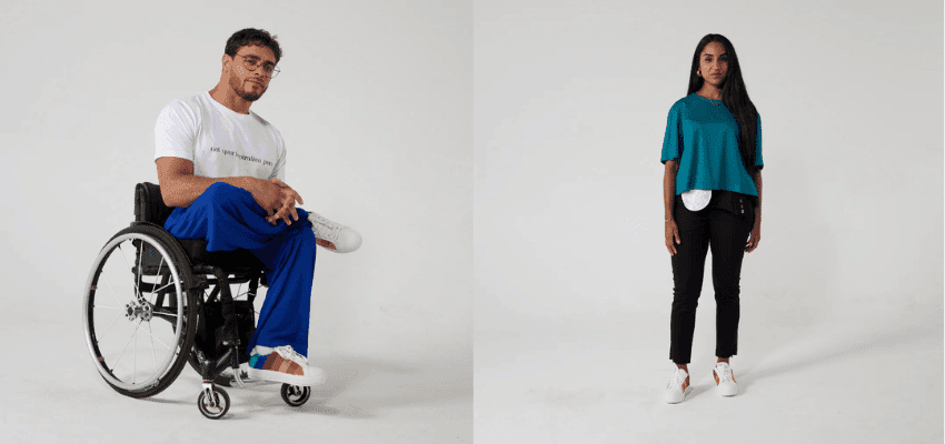 Two disabled models wearing adaptive clothing, including a wheelchair user and a woman with an ostomy bag, showing inclusive and accessible fashion. Adaptive fashion UK, disability-friendly clothing, shopping discounts for disabled people.”