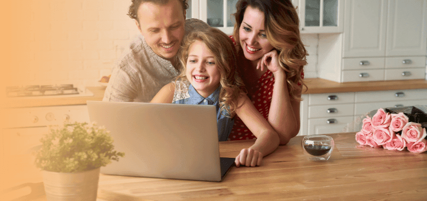 Family accessing Young Wellbeing Hub digital wellbeing services on a laptop.
