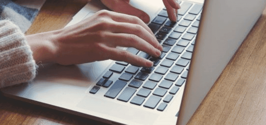 Hands typing on a laptop, Stone Refurb Purpl discounts for disabilities and long term health conditions, mobility discounts and offers.