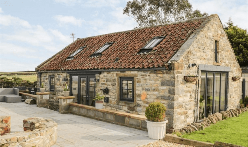Stone cottage with patio at Sykes Cottages, Purpl discounts for disabilities and long term health conditions, disabled travel discounts UK.