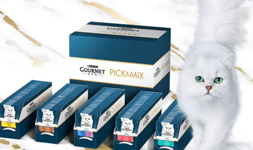 Gourmet cat food Pick and Mix box with a white cat, showcasing variety and choice for pet owners using mobility discounts and offers in the UK.