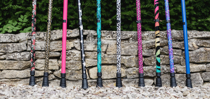 Colourful patterned crutches lined up outdoors, Cool Crutches Purpl discounts for disabilities and long term health conditions, mobility discounts and offers.