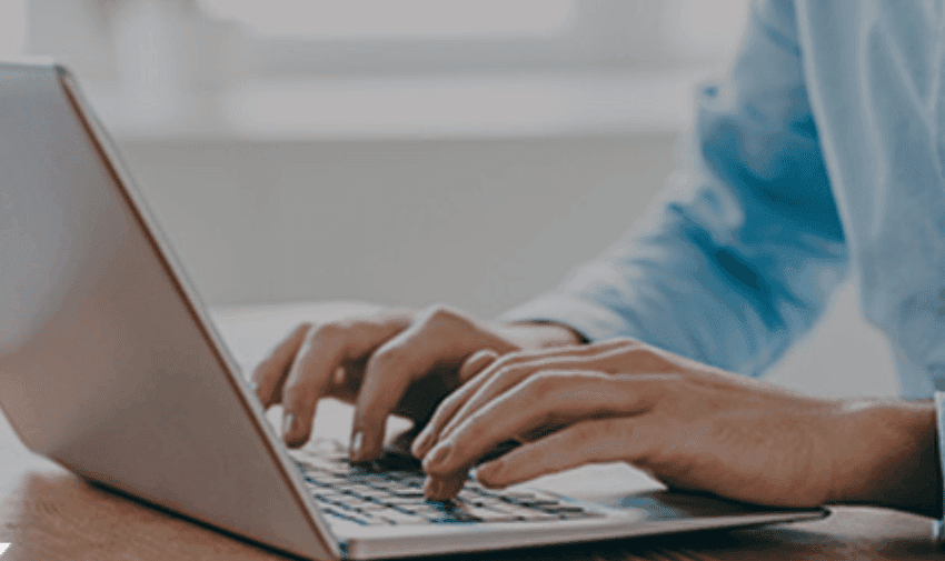 Hands typing on laptop, Stone Refurb Purpl discounts for disabilities and long term health conditions, shopping discounts for disabled people.