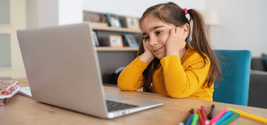Girl using a laptop at home, Young Wellbeing Hub, Purpl discounts for disabilities and long term health conditions, mobility discounts and offers.