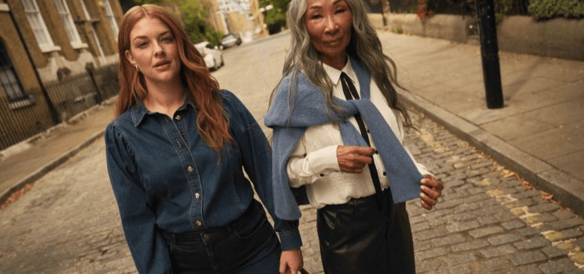 Stylish women walking in autumn fashion outfits promoting JD Williams disabled discounts, highlighting seasonal clothing savings for disabled people in the UK.