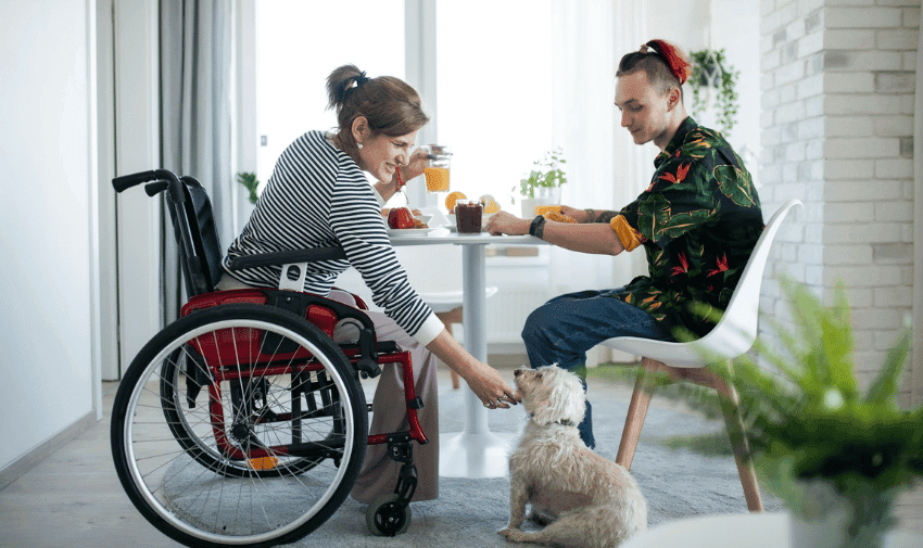 Woman in wheelchair at breakfast table, MedExpress Purpl discounts for disabilities and long term health conditions, mobility discounts and offers.