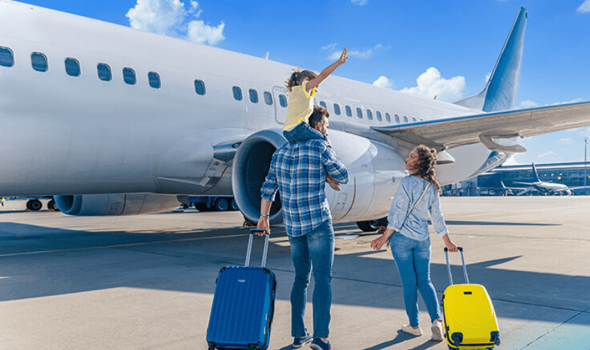 Family with suitcases beside aeroplane, TravelUp Purpl discounts for disabilities and long term health conditions, disabled travel discounts UK.