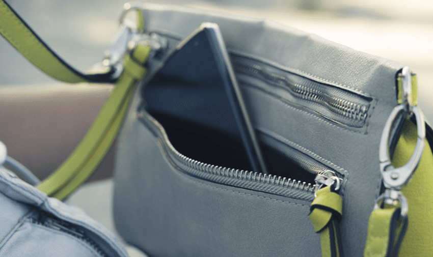 Grey crossbody bag with smartphone, CoverMy Gadget Purpl discounts for disabilities and long term health conditions, shopping discounts for disabled people.