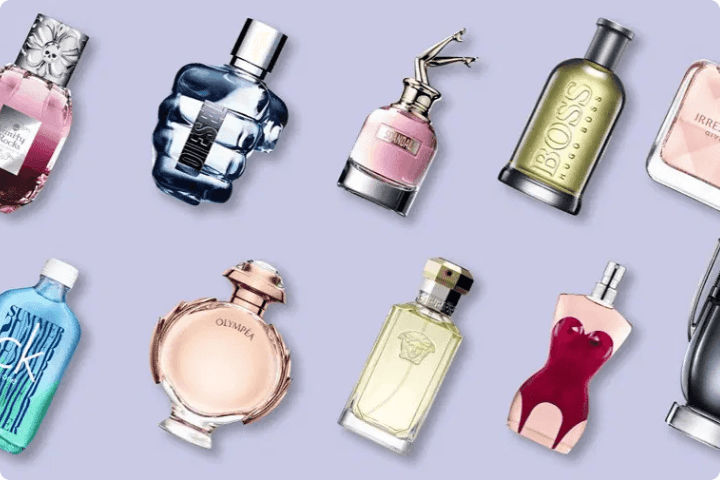 Pale purple background with a variety of different perfume and aftershave bottles on it, from the fragrance shop discount codes page of purpl