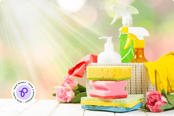 Spring cleaning scene with spring colours, lots of cleaning products and the purpl logo