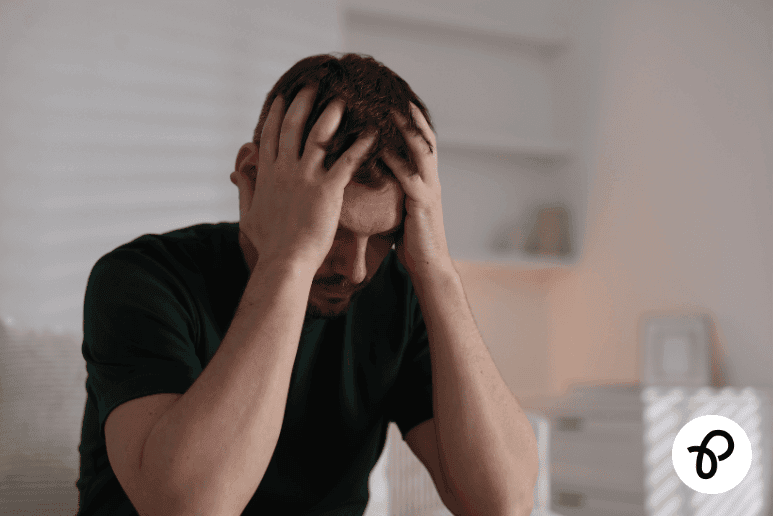 Man experiencing psychological distress related to mental health conditions affecting travel and disability support relevant to Purpl discounts.