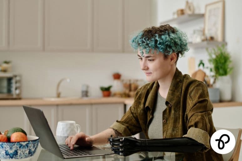 Person working from home on a laptop while living with disabilities or long term health conditions and accessing UK disability benefits and Purpl discounts.